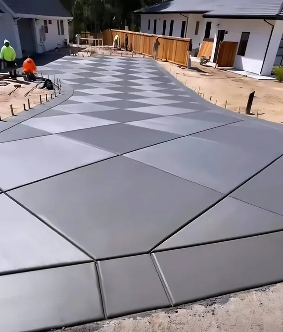 Close-up of large geometric outdoor tiles arranged in an angular pattern.