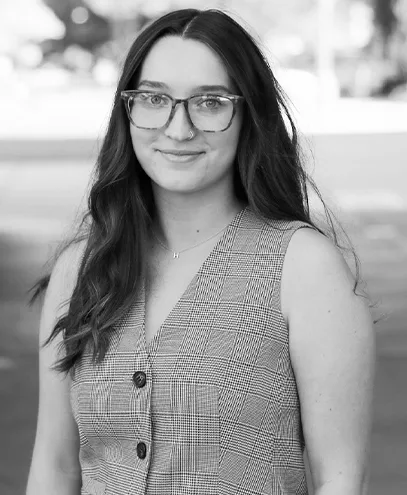 Rustic hallway featuring white shiplap walls and small recessed shelves.