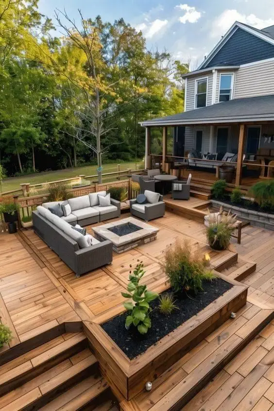 Cozy outdoor patio with wooden decking, fire pit, and comfortable seating area.