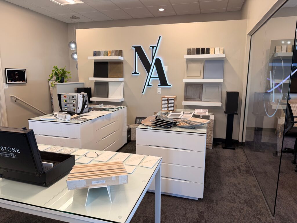 Design Studio: An interior view of a professional design studio or showroom featuring white cabinetry and sample displays.