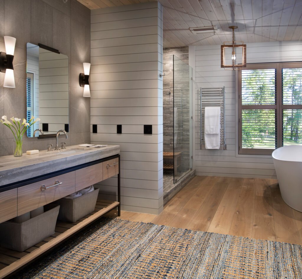 Bathroom vanity with wood cabinetry and tiled shower