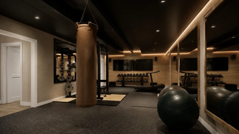 Basement home gym with dark ceilings, warm accent lighting, exercise equipment, and open workout space